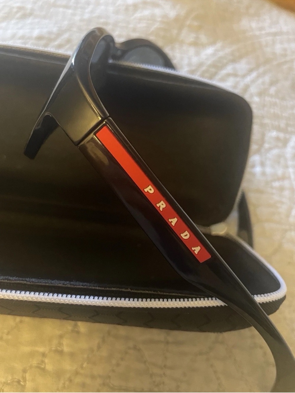 Prada Black Sunglasses with Red Temple Logo Accent